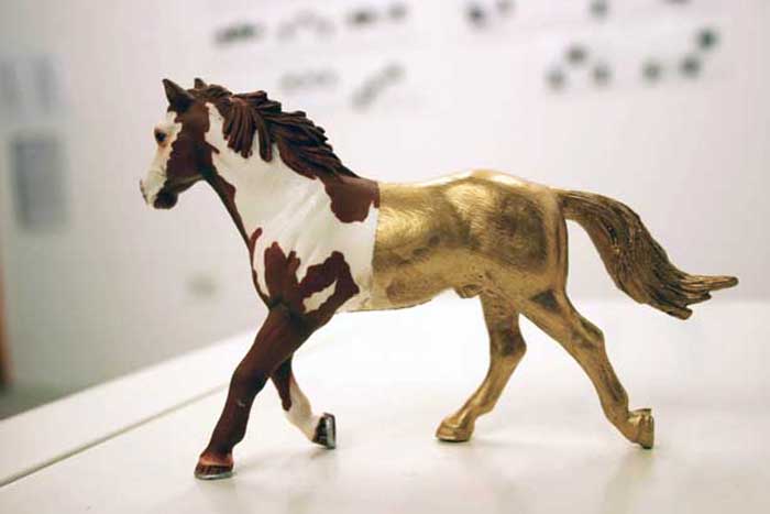 Secrets and Lies, plastic horse, gold leaf, 2010
